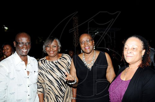 Winston Sill / Freelance Photographer Kingston's Mayor Desmond McKenzie is surrounded by beauty as he lymes with (from second left) wife Marcia, Audrey Hinchcliffe and Doreen Frankson.  *************************************************************************** and host Appreciation Party, held at Eden Gardens, Lady Musgrave Road on Thursday night December 30, 2010.