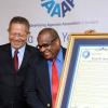 Rudolph Brown/Chief Photographer
Arnold J Foote, (right) president of the Advertising Agencies Association of Jamaica, presents the award for media Personality of the year to Lloyd B Smith, looking on at left is Prime MInister Bruce Golding at AAAJ Media Awards 2009  at Knutsford Court Hotel  New Kingston. on Wednesday, June 10-2009