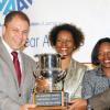 Rudolph Brown/Chief Photographer
Arnold J Foote, (left) president of the Advertising Agencies Association of Jamaica, presents the winning award for media of the year to The Gleaner's Nordia Craig (second right) Yvonne Senior, (second left) and Christopher Barnes, (right) deputy managing director of The Gleaner Company at AAAJ Media Awards 2009 at AAAJ Media awards luncheon at Knutsford Court Hotel  New Kingston. on Wednesday, June 10-2009