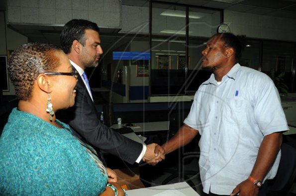 Ian Allen/Photographer
Jesus Silva bids farewell to Gleaner Editorial staff.