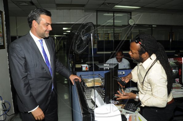 Ian Allen/Photographer
Jesus Silva bids farewell to Gleaner Editorial staff.