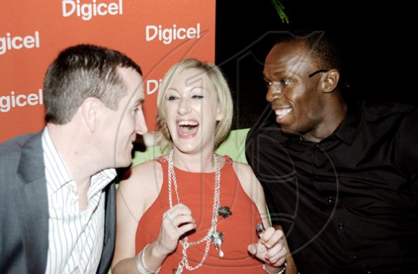 Winston Sill / Freelance Photographer
Digicel's  CEO Mark Linehan (left); Antonia Graham and Usain Bolt have much to smile about at the reception hosted by the prime minister at Jamaica House last Friday.


 (right).
Prime Minister Bruce Golding and Lorna Golding host "Golden Reception" for Jamaica's World Championships Athletics Team, held at Jamaica House Grounds on Friday night October 2, 2009.