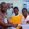 Anthony Minott/Freelance Photographer
Keith Blake (left), Councillor for the Independence City Division hands over book vouchers to Jamar Samuels (right), and Ronaldo Able during a back-to-school project instigated by Councillor for the Independence City Division, Keith Blake.