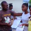 Anthony Minott/Freelance Photographer
Keith Blake (left), councillor for the Independence City Division hands over book vouchers to two students from his division during a back-to-school project instigated by Councillor Blake recently.