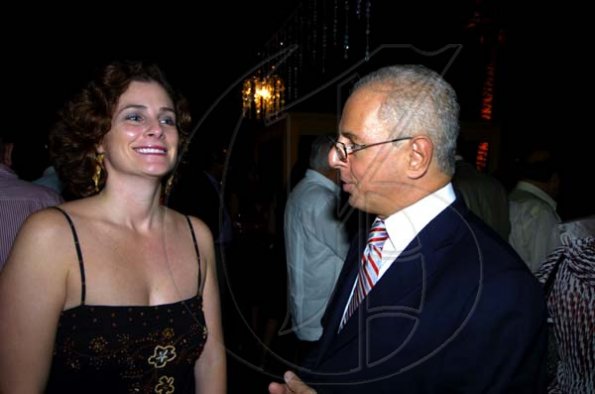Winston Sill / Freelance Photographer
The always lovely Debra Lopez chats with Paul Issa at the FirstCaribbean Bank farewell function for Christopher Bovell, held at the Jamaica Pegasus Hotel, New Kingston night December 17, 2009.