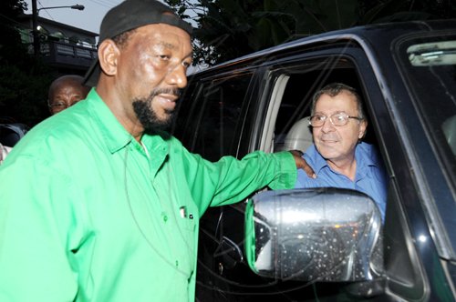 Ricardo Makyn/Staff Photographer
Ruddy Spencer (left), health minister and Jamaica Labour Party member of parliament, chats with People's National Party activist and lawyer, Abe Dabdoub, on Tuesday evening.