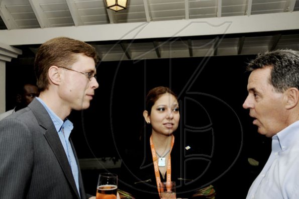Winston Sill / Freelance Photographer
Canadian High Commissioner Stephen Hallihan (right) chats with John Davis (representing Canada) and Amada Mendez (Dominican Republic), delegates for the
Caribbean-Canada Emerging Leaders Dialogue. High Commissioner Hallihan hosted a reception for the delegates on Tuesday at Seymour Avenue.

 on Tuesday night June 7, 2011.