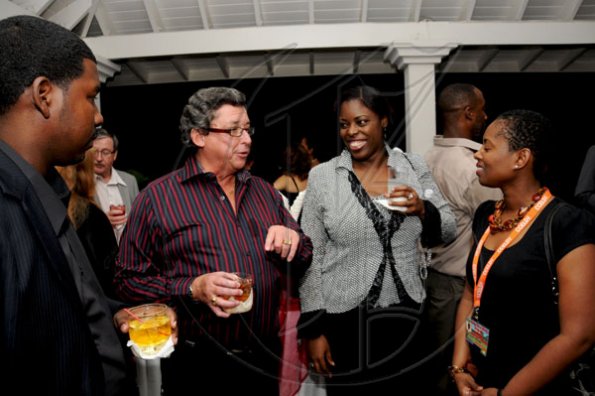 Winston Sill / Freelance Photographer
Anthony Bell (second left) raps with Caribbean-Canada Emerging Leaders Dialogue delegates (from left) Dylan Williams, Vicki Marshall and Chandra Williams.

Canadian High Commissioner, Stephen Hallihan and his wife Cathy host a Reception for delegates to the Caribbean-Canada Emerging Leaders Dialogue (CCELD), held at Seymour Avenue on Tuesday night June 7, 2011.