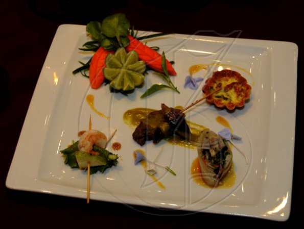 Winston Sill / Freelance Photographer
Chef Brain Lumley prepared a platter of some delectable  finegar food: peppered Shrimp with water chestnut and green apple salad glazed with balsamic vinegar, mini bacon quiches, beef kabob roasted with sweet pepper and pasta sauce and Vietnamese spring roll glazed with pineapple sauce absolutely divine. 

Launch of Armand De Brignac Champagne, held at Bin 26, Devon House, Hope Road on Tuesday night July 5, 2011.