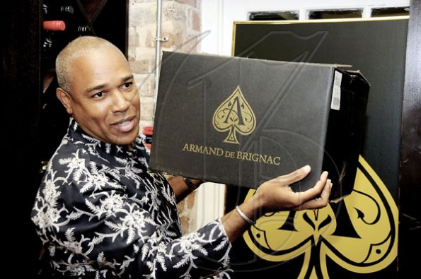 Winston Sill / Freelance Photographer
Bin 26 Wine Bar's Christopher Reckord showing off a case of Armand De Brignac, the number one ranked champagne in the world which is available now at Bin 26 Wine Bar.

***************************************************

Launch of Armand De Brignac Champagne, held at Bin 26, Devon House, Hope Road on Tuesday night July 5, 2011.
