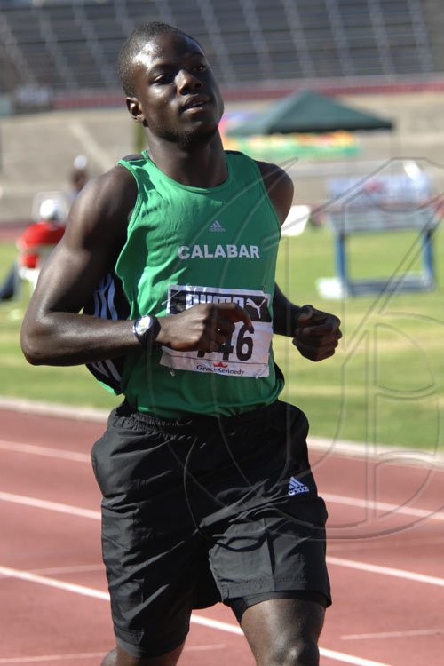 Ian Allen/Staff Photographer
Ramone McKenzie of Calabar High winning heat 5 of the class 1 boys 200m at the 2009 Boys and Girls Atlethics championships.