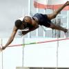 Ian Allen/Staff Photographer
K'Don Samuels of Jamaica College (JC) clears the bar at 4.45 metres to set a new record in the boys' pole vault, at the Inter-Secondary Schools Sports Association (ISSA)/GraceKennedy Boys and Girls' Athletic Championships, at the National Stadium yesterday.