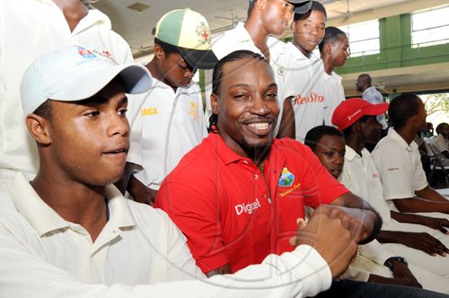 Rudolph Brown/Chief Photographer
West Indies' captain Chris Gayle chat with Oshane Sivewright captain of the Excelsior High School cricket team during a Digicel cricket experience at Excelsior High School on Wednesday, June 24-2009