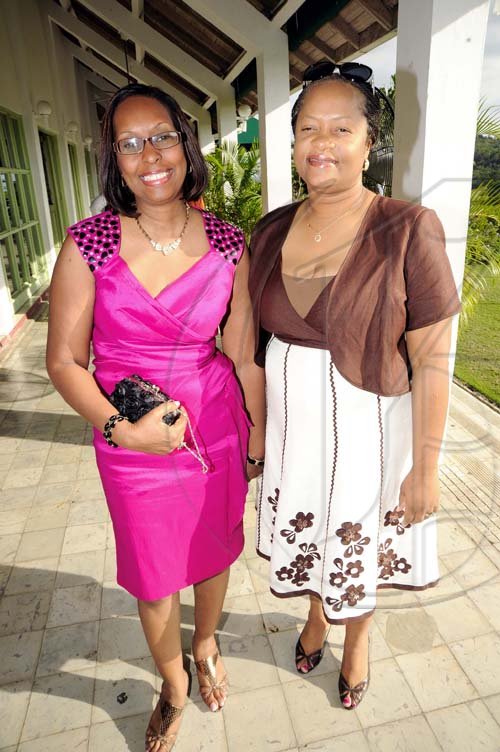 Rudolph Brown/Photographer Genaral Manager Sandra Thompson (right) and  Yvonne Purcellarrive for the luncheon.  ************************************************************ at the St. Catherine Co-operative Credit Union Christmas awards luncheon at Caymanas Golf and Country Club on Wednesday, December 22-2010