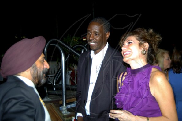Winston Sill / Freelance Photographer
Indian High Commissioner Mohinder Grover (left) cracks up US Charge d'Affairs Isiah Parnell and Mexican Ambassador Leonora Rueda.

Consular Corps host Cocktail Reception to say farewell to the British High Commissioner, held at Spanish Court Hotel, New Kingston on Wednesday december 2, 2009.