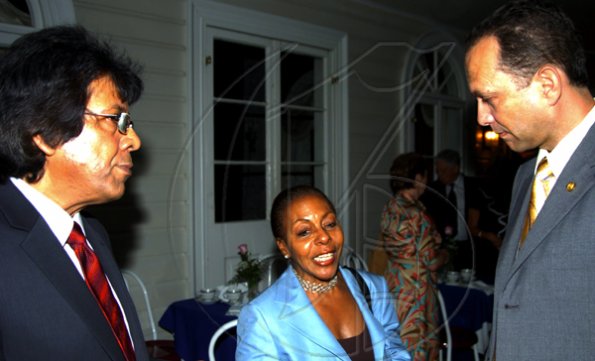 Winston Sill / Freelance Photographer
Pat Ramsay (centre) holds court with Kenny Benjamin (left) and William Tavares-Finson at the Consular Corps of Jamaica presents High Tea held at King's House, Hope Road on Thursday January 21, 2010.