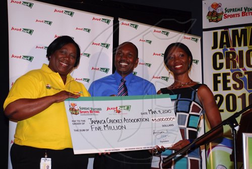 Colin Hamilton/freelance photographer
From left, VP, Group Corporate Communications - Supreme Ventures Ltd. Sonia Davidson, hands over a cheque to the President of the JCA Paul Campbell and Millicent Lynch at the Jamaica Cricket Festival 2010 Media Launch at the Acropolis Gaming Lounge on Tuesday March 9, 2010.