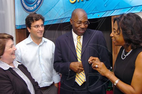 Rudolph Brown/Chief Photographer
Sandra Glasgow, (right) Chief Executive Officer of the Private Sector Organisation of Jamaica chat with Anne Molyneux, (left) Director of CS International, Santiago Chaher, (second left) Consultant Global Corporate Governance Forum, International Finance Corporation and Karl Williams, (second right) of Sagicor Life Jamaica at the welcome cocktails hosted by the PSOJ on the train-the-Trainer programme being hosted by the PSOJ in association with the International Finance Corporations Global Corporate Governance Forum. at the Spanish Court Hotel in New Kingston on Thursday, March 19-2009
?