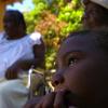 Ricardo Makyn/Staff Photographer.
Right Sasheen Empty Sister of Courtney Walker "CJ"  who was stabbed 57 times to death looks on as Her Grandmother in the background from left Sarah Carlyle and Family Friend Rosetta Wright reflect on the Life of CJ on Friday 20.3.2009.