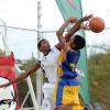 Ricardo Makyn/Staff Photographer.
Ardenne High's Joseph Thomas is blocked by Jamaica College's Jhevon Redman during their ISSA KFC All-Island Under-16 final at the National Stadium Court on Thursday. JC won 53-51 for their first hold on the title.