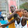 Ricardo Makyn/Staff Photographer
Ardenne High's Stephen Silvera (left) and Jamaica College's Sekou Brown (centre) tussle for possesion during the ISSA KFC All-Island Basketball Under-16 final at the National Stadium Courts yesterday. JC won the game 53-51 for their first ever hold on the championship.  See more on page 57.
