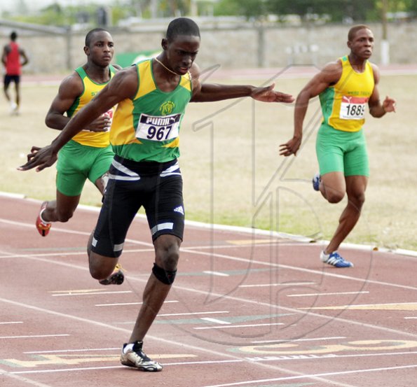 Ian Allen/Staff Photographer
Old Harbour High's Kemar Bailey-Cole wins the boys' Class One 100m on yesterday's opening day of the Milo-sponsored Central Track & Field Championships at G.C. Foster College.