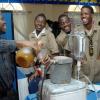 Ian Allen/Staff Photographer
George Palmer left, chemistry teacher at Kingston Technical high school demonstrates how biodiesel is made to some students attending the Jamaica Public Service Science and Technology EXPO 2009 at the Knutsford Court Hotel in Kingston yesterday.