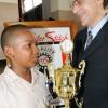 Rudolph Brown/Chief Photographer
Laurence Heffes, of Master Stitch, Heffes Sales Company limited presents Timothy Hitchener of Our Lady of the Angels Prep school with the winning trophy of the Lay Magistrates Association of Jamaica  National Essay competition 2009 at Holy Cross Church Hall, 17 Half Way Tree Road in Kingston on Wednesday, June 17-2009