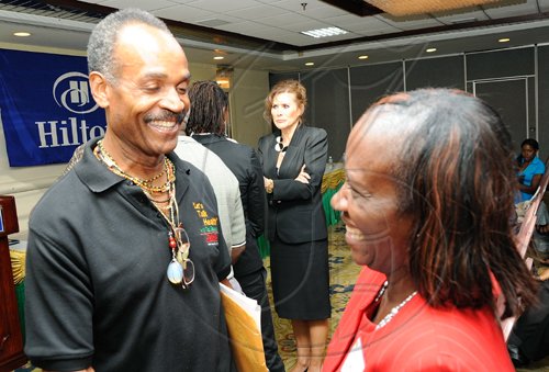 Rudolph Brown/Chief Photographer
Winnie Anderson-Brown, Laughter Yoga Certified laughter instructor chat with Ted Emanuel at the Caribbean Veggie Fest Spa and Wellness Conference 2009 at the Hilton Hotel in New Kingston on Friday, June 12-2009