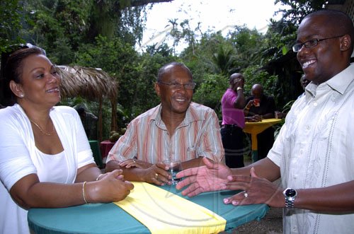 Peta-Gaye Clachar/Staff Photographer
Hostess Jillian Green (left) assistant manger of Boone Hall Oasis and Douglas Harris chats with guest Leighton Smith (right) at the Capital and Credit day of "tropical splendour" at Boone Hall Oasis in Stony Hill, St. Andrew on Saturday, February 28, 2008.