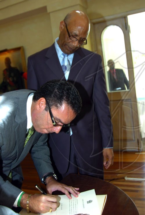 Norman Grindley /Chief Photographer
Daryl Vaz  sworn-in for the second time as minister of state in the office of the prime Minister office at Kings house April 1, 2009.