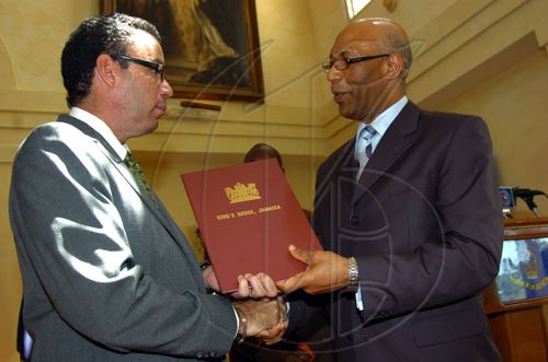 Norman Grindley /Chief Photographer
Daryl Vaz  sworn-in for the second time as minister of state in the office of the prime Minister office at Kings house April 1, 2009.