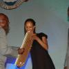 Colin Hamilton/Freelance Photographer
NDTC dancer Kerry-Ann Henry recieves the UWI pelican Award on behalf of the NDTC from Noel Dexter, Howard Cooper (R) looks on.at the Grand Commemoration Concert & Pelican Awards at the UWI Auditorium - February 22