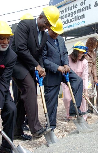 Rudolph Brown/Chief Photographer
Governor General Sir Kenneth Hall, (centre) break ground with from left Ryland Campbell, Chairman,CCMB, Winston Adams, President of UCC, Geraldine Adams CEO and Dr. Velma Brown-Hamilton, Broard member at the University College of the Caribbean  groundbreaking and dedication for the Worthington Campus expansion on Monday, February 23-2009.