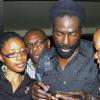 Peta-Gaye Clachar/Staff Photographer
Buju Banton (center) signs his CD for fans at the launch of his new album "Rasta Got Soul" at the Undercroft at UWI Mona Campus on Wednesday, April 23, 2009.