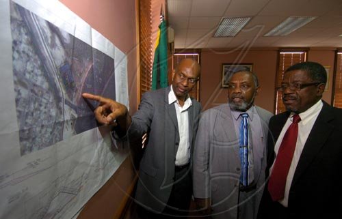 Ricardo Makyn/Staff Photographer.
Left Ivan Anderson Chief Executive Officer NROC with Minister of State in the Ministry of Transport and Works Joseph Hibbert and Don Mullings Managing Director M&M Jamaica Limited at the contract signing for the Jam World Fishing Village beach rehabilitation works and repairs to drainage network in Kingston at the Ministry of Transport on Thursday 23.4.2009.