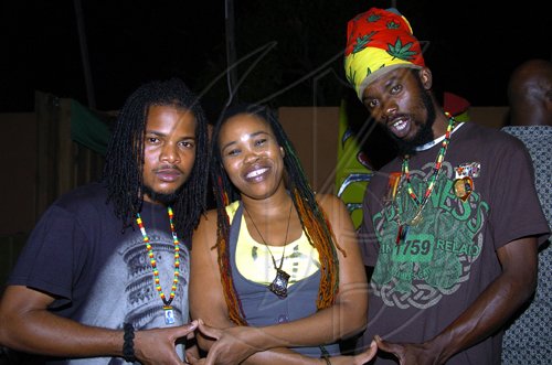 Peta-Gaye Clachar/Staff Photographer
Recording Artiste Queen Ifrica hangs out with her pals at theTribute show for Egbert Evans at the Deck in New Kingston on Wednesday, April 22, 2009.