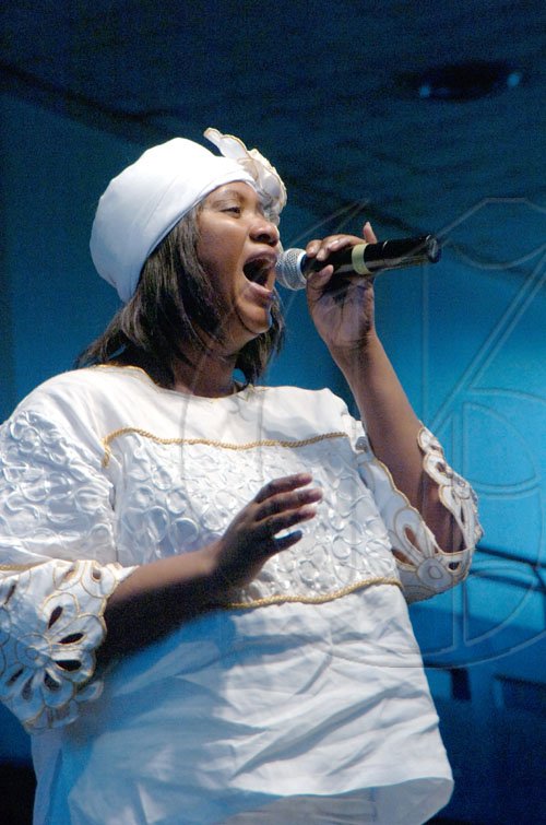 Rudolph Brown/Chief Photographer
Evangelist Sandra Brooks ministry music at the United  Voice of The Church hosted prayer & restoration service Heal the Family Heal the Nation, the 4th National call Theme: "A Travailing Session" at the National Arena on Wednesday, March 4-2009