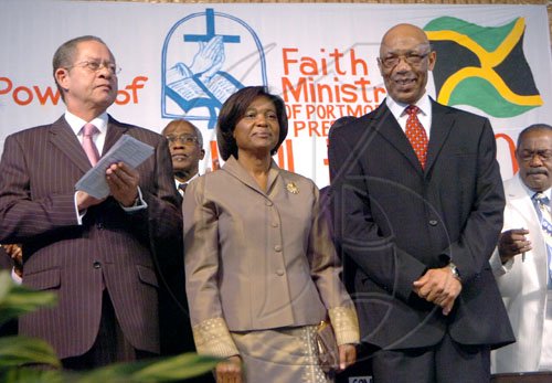 Rudolph Brown/Chief Photographer
Dr Patrick Allen, (right) Governor General and his wife Patricia, and Prime Minister Bruce Golging at the United  Voice of The Church hosted prayer & restoration service Heal the Family Heal the Nation, the 4th National call Theme: "A Travailing Session" at the National Arena on Wednesday, March 4-2009