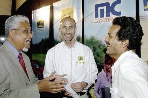 Winston Sill / Freelance Photographer
Vice-chancellor of the University of the West Indies Prof E Nigel Harris (left) jokes with Alan Beckford (centre), general manager of the Jamaica Automobile Association and Dr Richard Aitken, surgeon at the Kingston Public Hospital. Launch of Jamaica's first GPS Navigation System, held at the Senior Common Room (SRC), UWI, Mona Campus on Thursday March 5, 2009