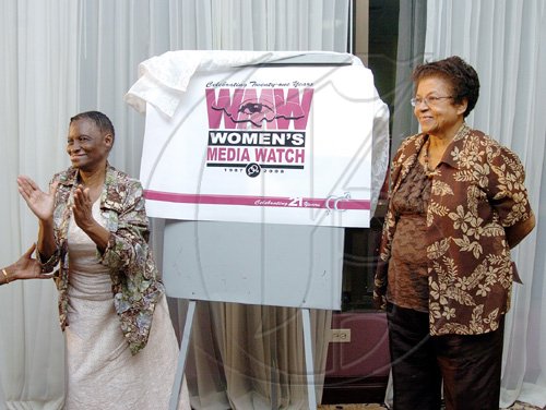 Peta-Gaye Clachar/Staff Photographer
Evelyn Scott honorary member and Hermione McKenzie (right) president of the Associates of Women Organizations in Jamaica unveils the anniversary logo at the tribute to women trailblazers and launch of womens media watch Jamaica 21st anniversary celebrations at the Hilton Hotel on Tuesday, March 3, 2009.