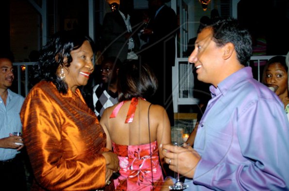 Winston Sill / Freelance Photographer
Mare Seeberan (left), have something pleasant to discuss.
***************************************************************

Christopher Levy.National Commercial Bank (NCB) host Dinner Party, featuring the Nobu Restaurants menu, held at Strawberry Hill, St. Andrew on Thursday night April 1, 2010.
