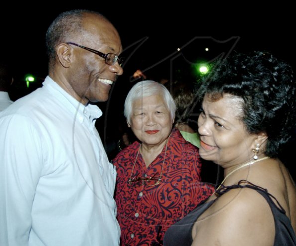 Joe Taffe, deputy chief executive officer of GraceKennedy
 Investments, catches up with Joanne Simpson (right) at last Thursday's  First Global customer appreciation event "A Touch of Culture",  at Jamaica Pegasus. Also looking on is Mabel Tenn.

Winston Sill / Freelance Photographer
First Global host "A Touch of Class" reception for clients,  held at the Jamaica Pegasus Hotel, New Kingston on Thursday November 12, 2009.