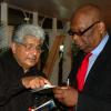 Colin Hamilton/freelance photographer
Arif Ali, author of the book "Jamaica Absolutely" shows Count Prince Miller something on the programme during the
Opening Ceremony of the Inaugural Future Leaders Jamaican Diaspora Conference at the Mona Visitors Lodge on Tuesday August 4, 2009.