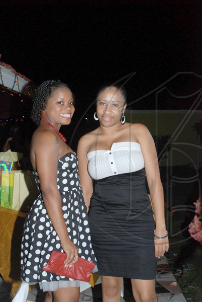 Janet Silvera Photo
 
 Jodex Williams (left) and Kadeen Simpson pose for the cameras Genus Pharmacy's Janet Genus's 50th birthday party last Saturday night at Villa Sonate in Cardiff Hall, St. Ann.