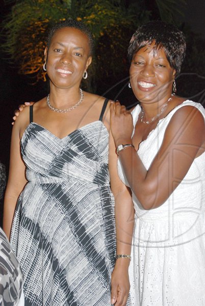 Janet Silvera Photo
 
Sister act, the Lawson sisters, Sandra and Jackie at the Genus Pharmacy's Janet Genus's 50th birthday party at Villa Sonate, Cardiff Hall, Runaway Bay in St. Ann.