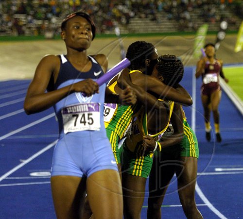 Ricardo Makyn/Staff Photographer.High School Girls' open  4x400 meters final at the Gibson Relays at the National Stadium on aturday