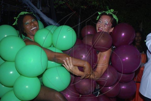 Janet Silvera Photo
 
Best costume winners, the creative Chinyre Nwaogwugwu (left) and Suki Kaphi wearing the 'Fruit of the Loom' get up in style at Groovy Grouper's Halloween party last Saturday night in Montego Bay.