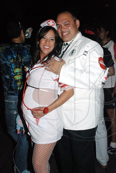 Janet Silvera Photo
 
Dr E Stein and Nurse Delightful, Ian and Carla Dear scored a hit in their costumes.

******************************************************** at Groovy Grouper's Halloween party last Saturday night in Montego Bay.