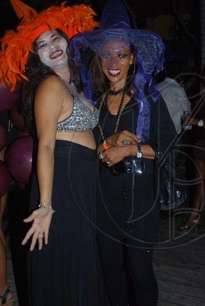 Janet Silvera Photo
 
Jacqui Bird and Joan Lee at Groovy Grouper's Halloween party last Saturday night in Montego Bay.